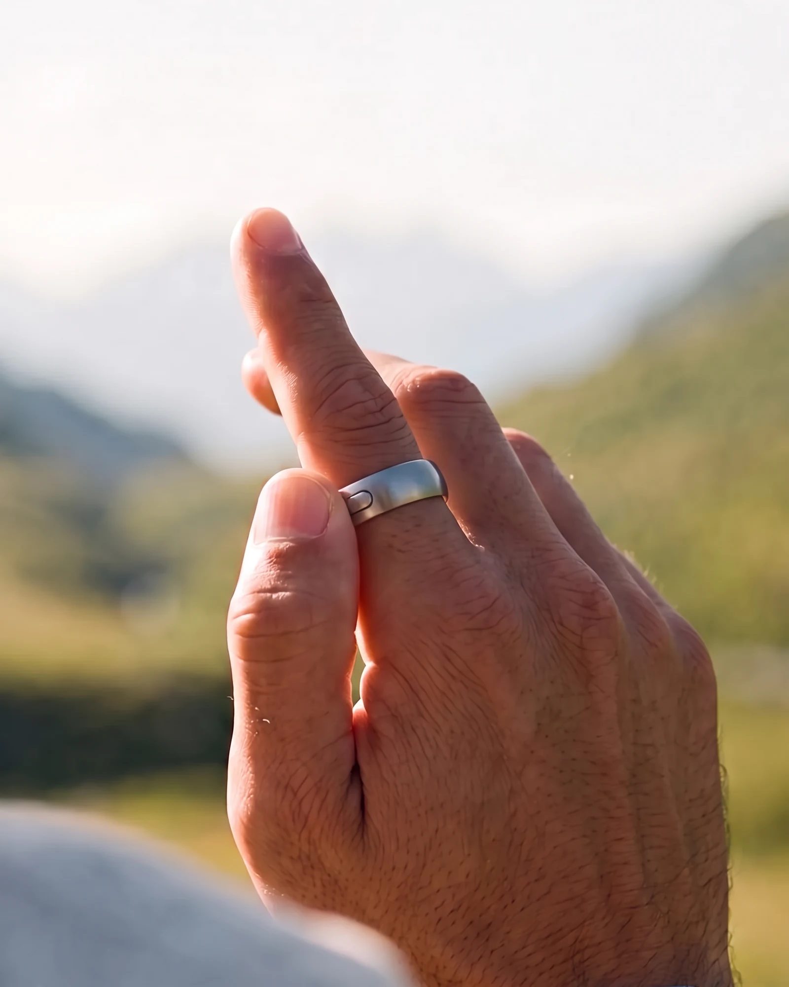 Close-up of a thumb pressing and holding the interface ring button