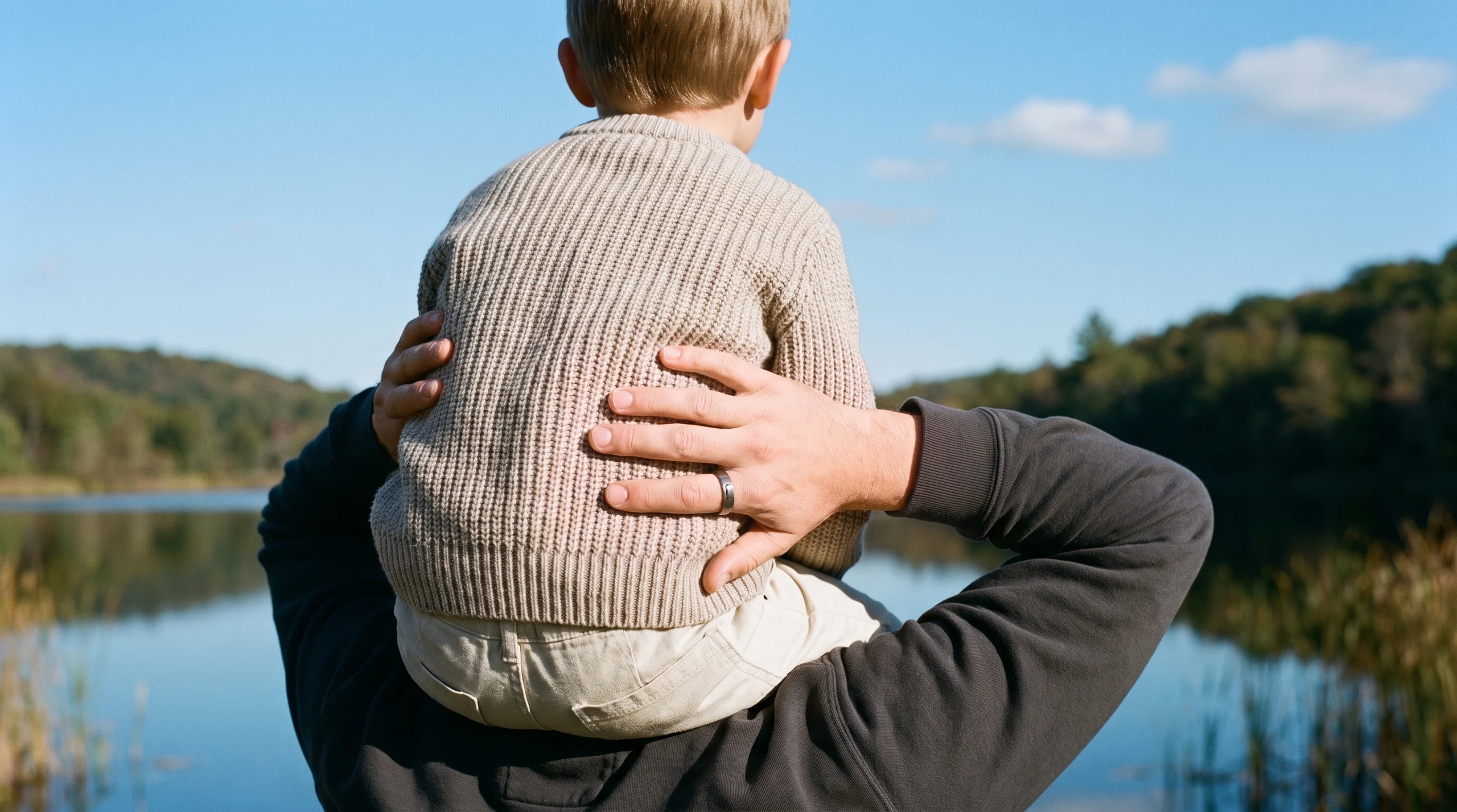 Person outdoors in clear natural light, the ring worn on the index finger, no phone anywhere