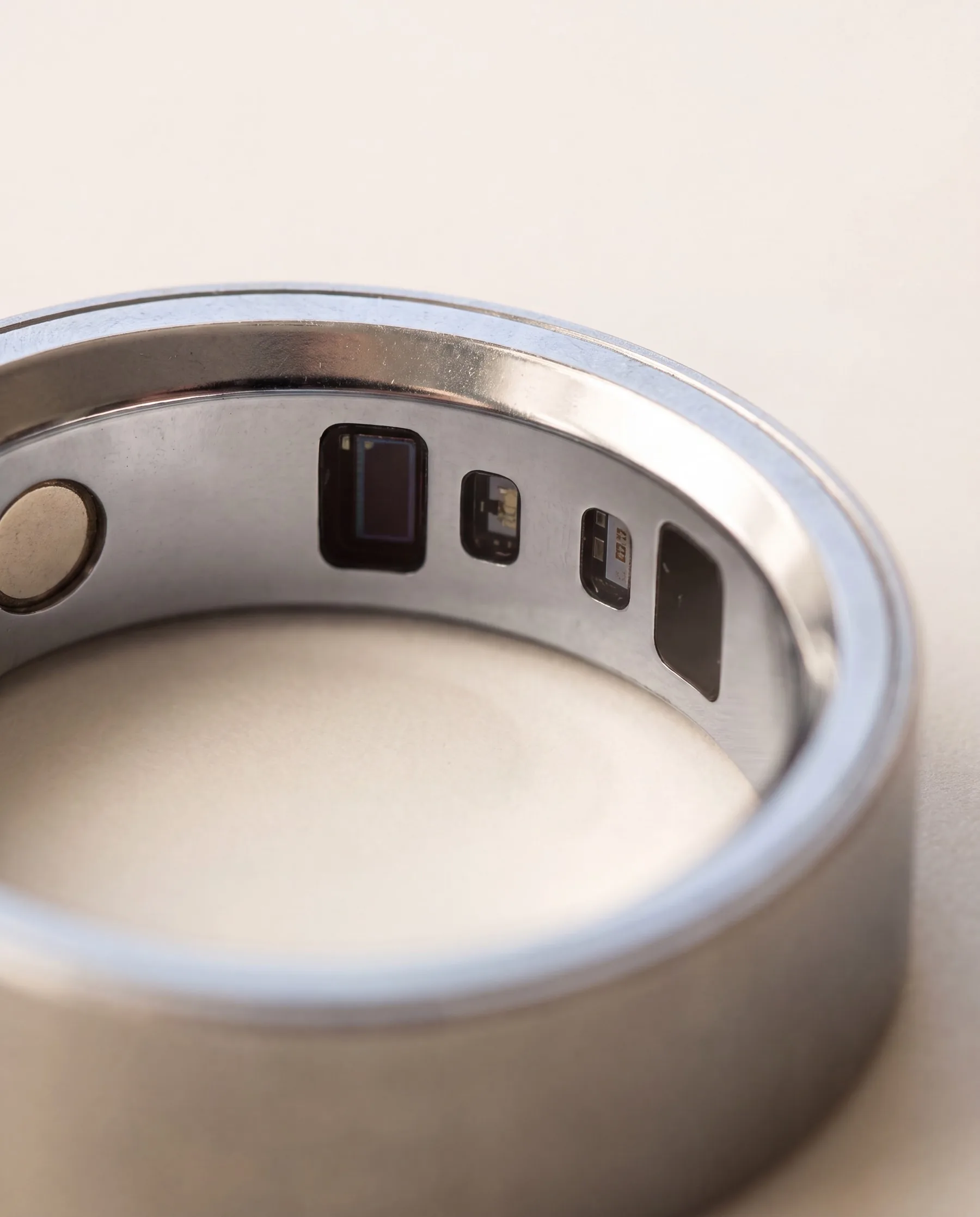 Extreme macro of the polished inner band with the flush sensor window and its four dies
