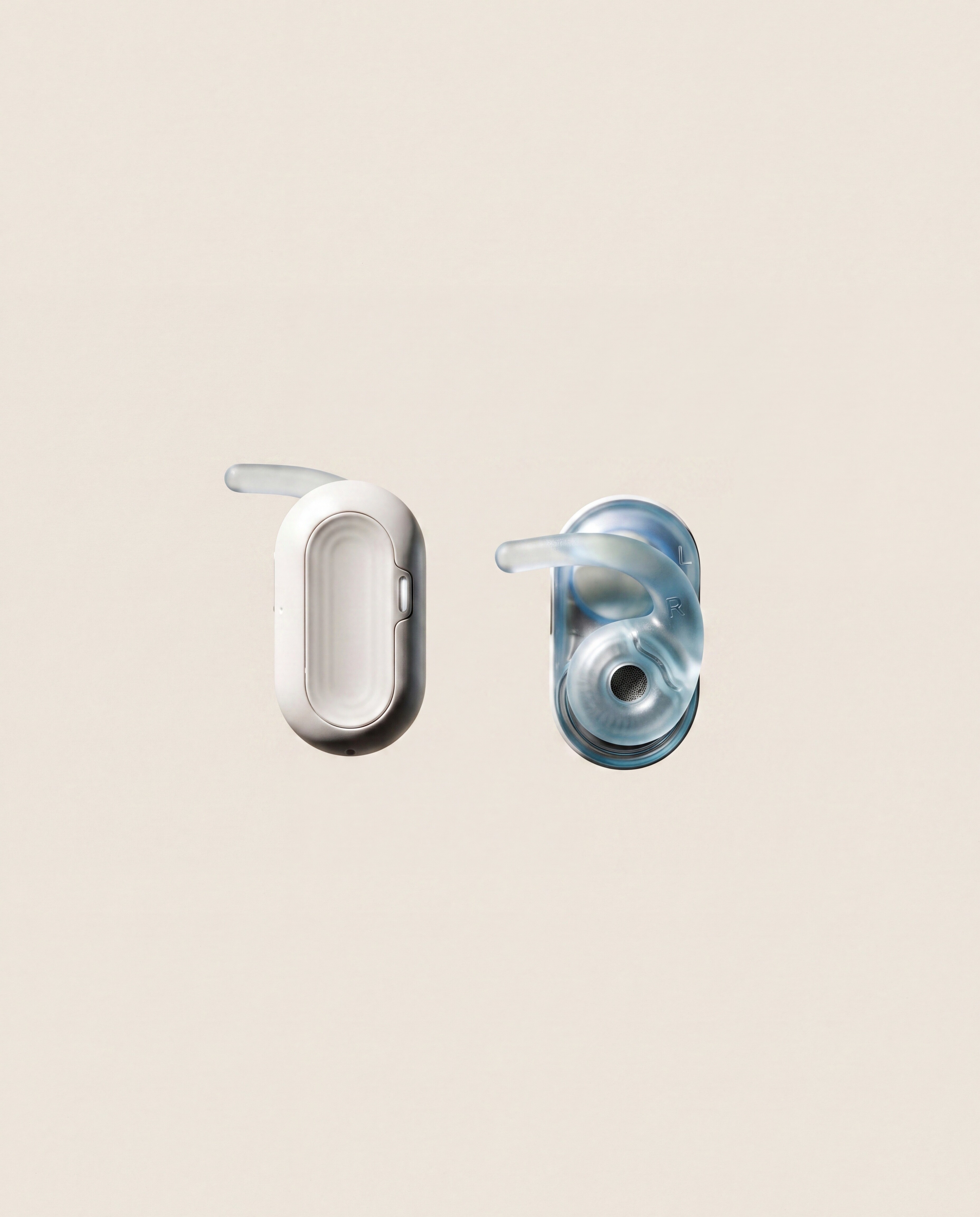 HumanPods pair — capsule body and translucent ear-hook wing